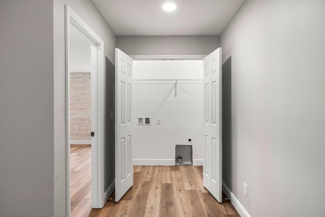 1523 Eads Bluff Rd NW, Georgetown, TN 37336 - laundry area with hookup for a washing machine, light wood-style flooring, electric dryer hookup, and baseboards