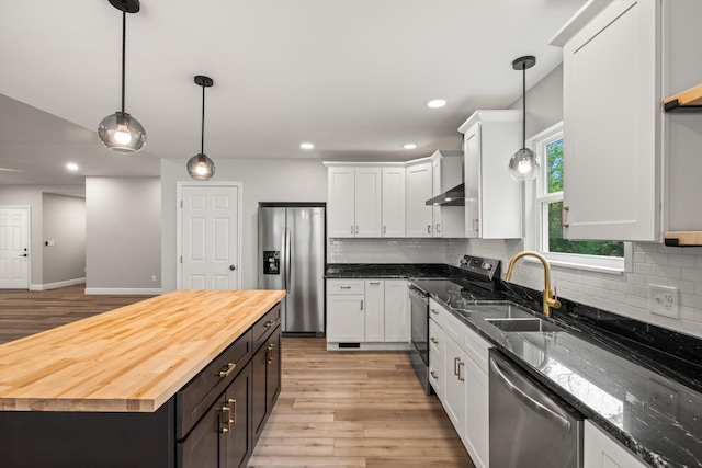 1523 Eads Bluff Rd NW, Georgetown, TN 37336 - kitchen with appliances with stainless steel finishes, wood counters, light wood-type flooring, white cabinetry, and recessed lighting
