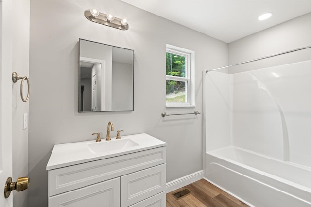 1523 Eads Bluff Rd NW, Georgetown, TN 37336 - bathroom with vanity,  shower combination, wood finished floors, and baseboards