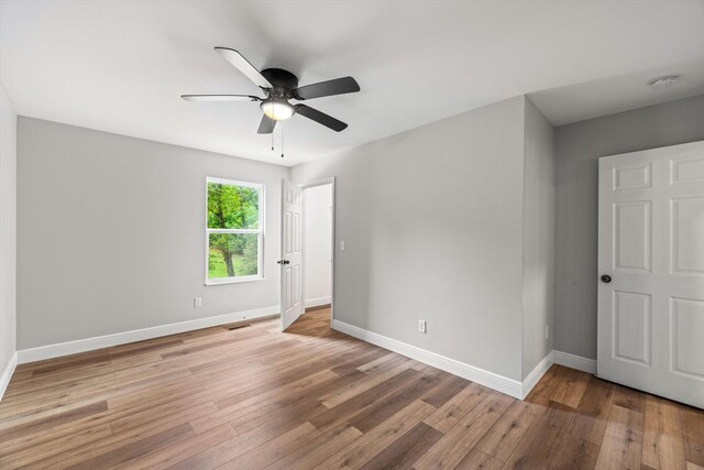 1523 Eads Bluff Rd NW, Georgetown, TN 37336 - unfurnished bedroom featuring wood finished floors, baseboards, and a ceiling fan