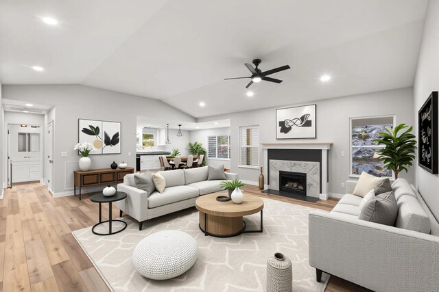 1523 Eads Bluff Rd NW, Georgetown, TN 37336 - living area featuring light wood-type flooring, ceiling fan, lofted ceiling, a fireplace, and recessed lighting
