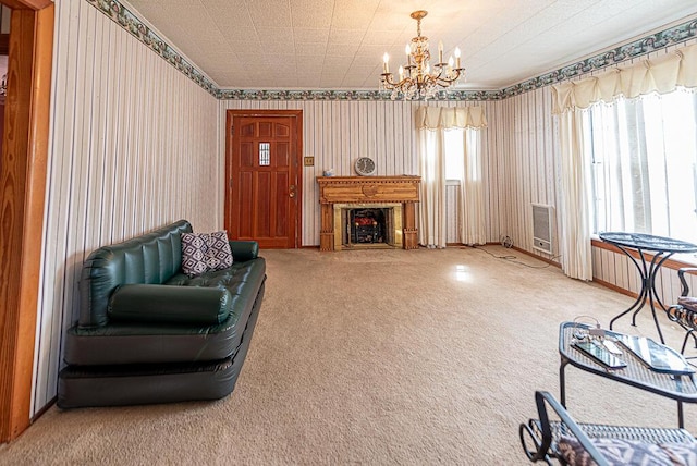 interior space featuring a notable chandelier, carpet flooring, and a fireplace