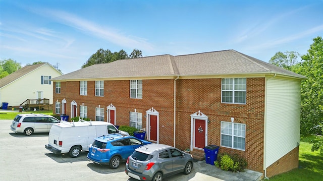 2861 Michigan Avenue Rd NE Unit 1-5, Cleveland, TN 37323 - view of property with roof with shingles, entry steps, uncovered parking, and brick siding