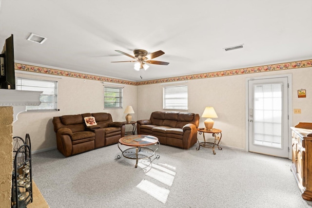 living room with light carpet and ceiling fan