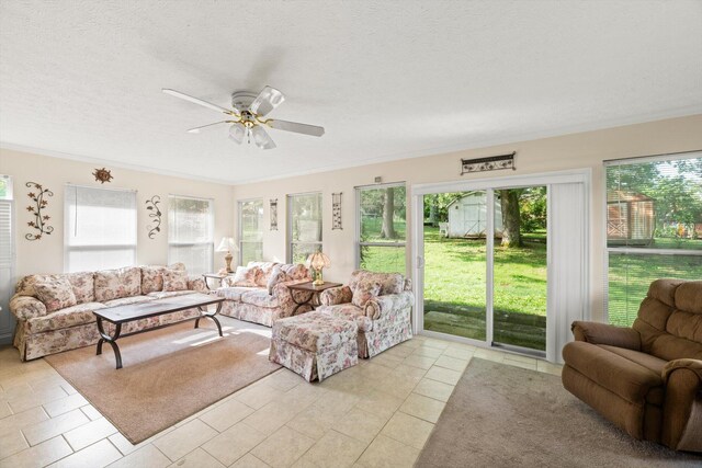 sunroom featuring ceiling fan