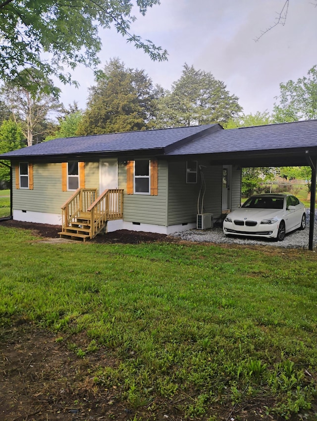 ranch-style home featuring a front lawn, crawl space, an attached carport, and central AC