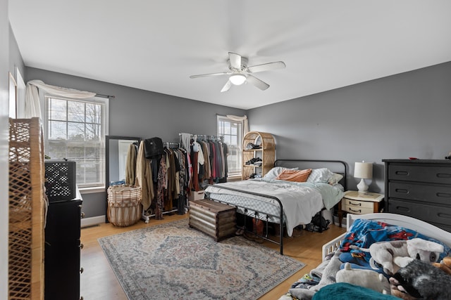 bedroom with wood finished floors and a ceiling fan