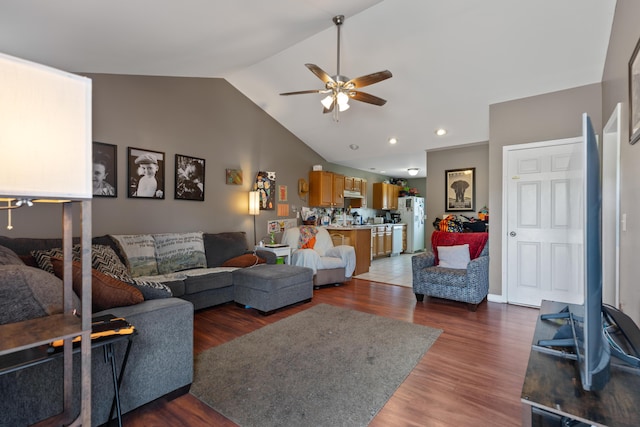 living area with wood finished floors, recessed lighting, vaulted ceiling, and ceiling fan