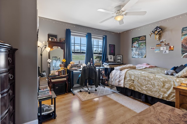 bedroom with wood finished floors and a ceiling fan