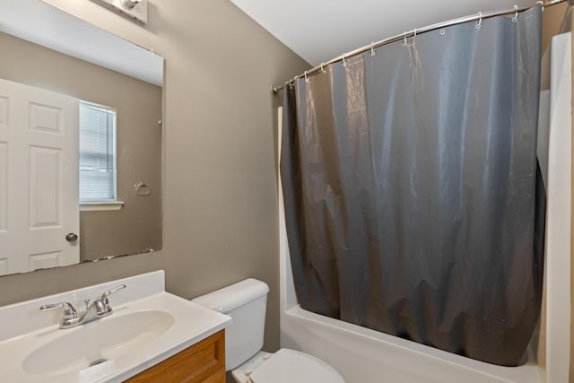 full bathroom with toilet, vanity, and shower / bathtub combination with curtain