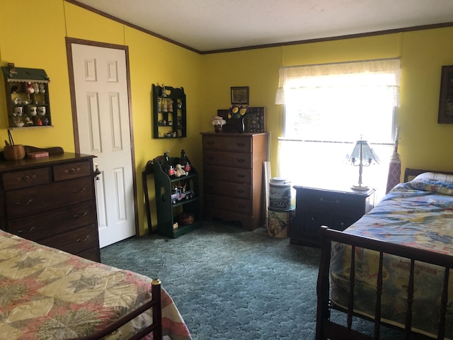 bedroom featuring ornamental molding, lofted ceiling, and carpet floors