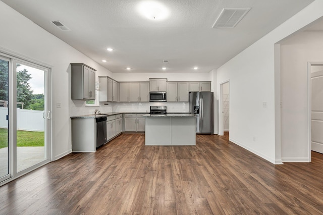 6026 Pearson Ln NW Unit 31, Cleveland, TN 37312 - kitchen with appliances with stainless steel finishes, gray cabinets, dark wood-style flooring, and recessed lighting