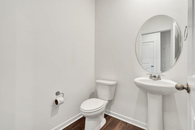 6026 Pearson Ln NW Unit 31, Cleveland, TN 37312 - bathroom with toilet, wood finished floors, baseboards, and a sink