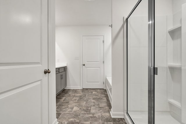6026 Pearson Ln NW Unit 31, Cleveland, TN 37312 - full bath with vanity, a stall shower, a bath, baseboards, and stone finish floors