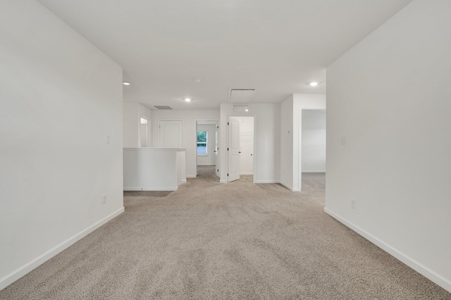 6026 Pearson Ln NW Unit 31, Cleveland, TN 37312 - unfurnished living room with attic access, light carpet, baseboards, and recessed lighting