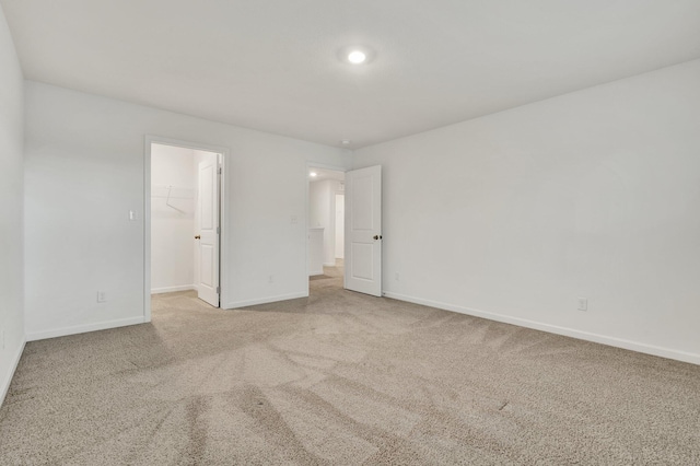 6026 Pearson Ln NW Unit 31, Cleveland, TN 37312 - unfurnished bedroom featuring carpet flooring, a walk in closet, and baseboards