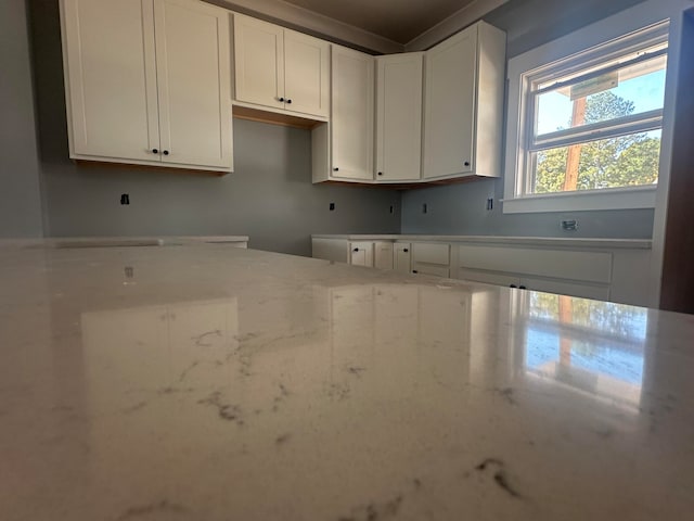 kitchen featuring white cabinets