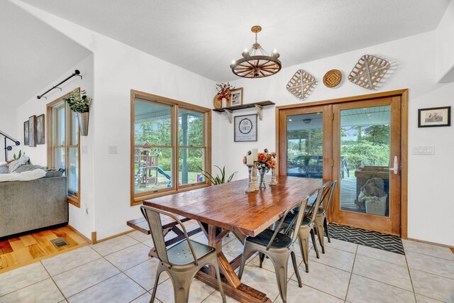 596 Clifty Creek Rd, Oakdale, TN 37829 - dining room featuring a chandelier, light tile patterned flooring, and baseboards