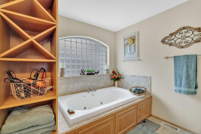 596 Clifty Creek Rd, Oakdale, TN 37829 - full bath featuring a whirlpool tub, baseboards, and tile patterned floors