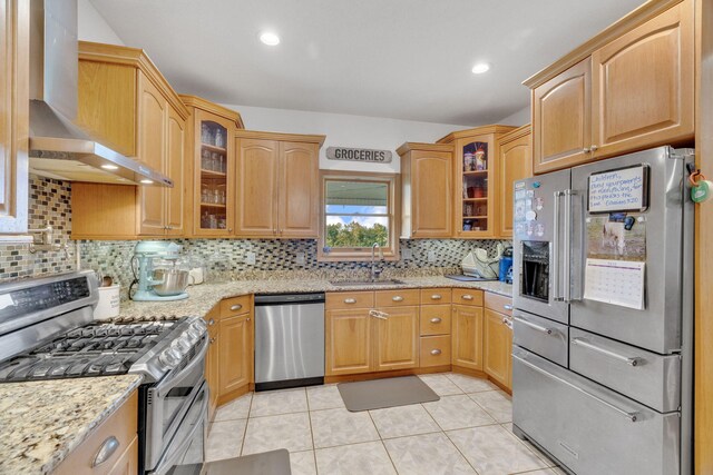 596 Clifty Creek Rd, Oakdale, TN 37829 - kitchen featuring stainless steel appliances, wall chimney exhaust hood, a sink, light stone counters, and decorative backsplash