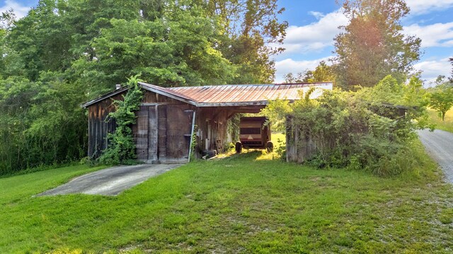 596 Clifty Creek Rd, Oakdale, TN 37829 - view of pole building featuring a yard and a carport