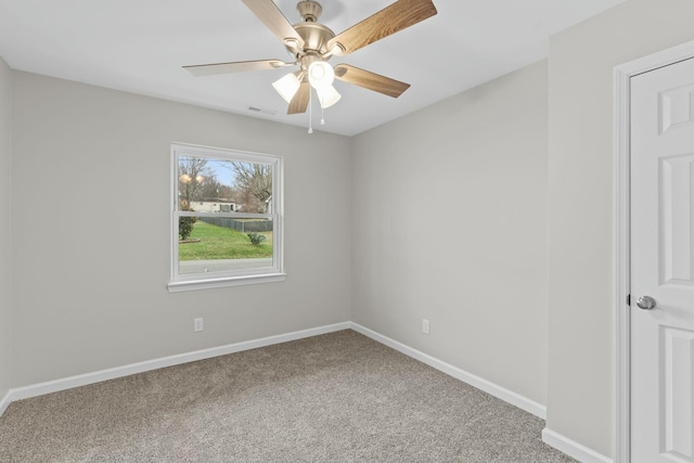 empty room featuring carpet flooring and ceiling fan