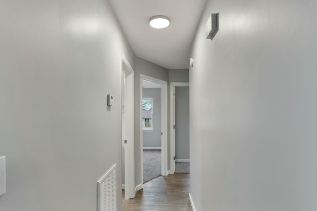 hall with light hardwood / wood-style flooring