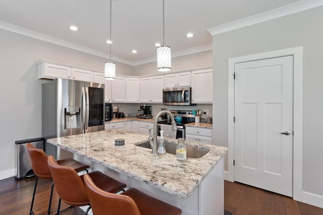 131 Winesap Way SW, Cleveland, TN 37311 - kitchen featuring stainless steel appliances, a sink, white cabinetry, crown molding, and dark wood-style floors
