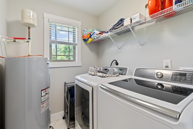 131 Winesap Way SW, Cleveland, TN 37311 - washroom with washer and clothes dryer, electric water heater, baseboards, and light tile patterned flooring
