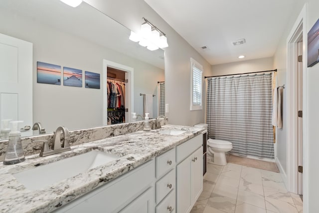 131 Winesap Way SW, Cleveland, TN 37311 - bathroom with double vanity, marble finish flooring, toilet, a shower with shower curtain, and a spacious closet