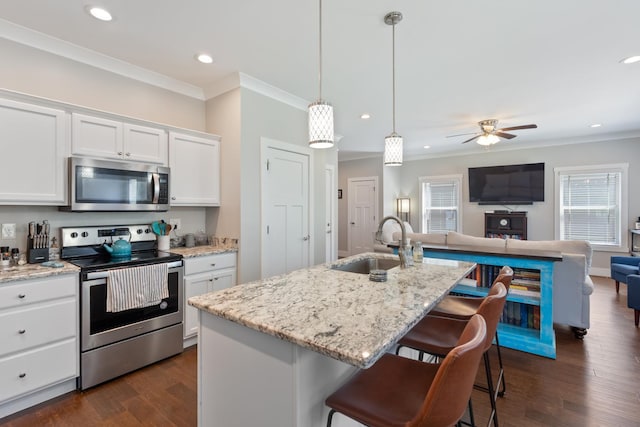 131 Winesap Way SW, Cleveland, TN 37311 - kitchen featuring appliances with stainless steel finishes, open floor plan, a sink, crown molding, and white cabinets