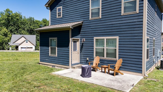 131 Winesap Way SW, Cleveland, TN 37311 - back of house featuring a lawn and a patio area