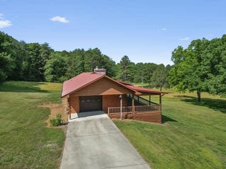 view of front of home with a front lawn and a garage