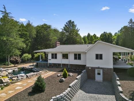 back of property featuring a carport