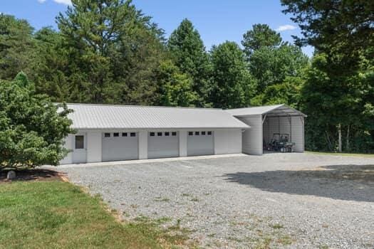 garage featuring a carport