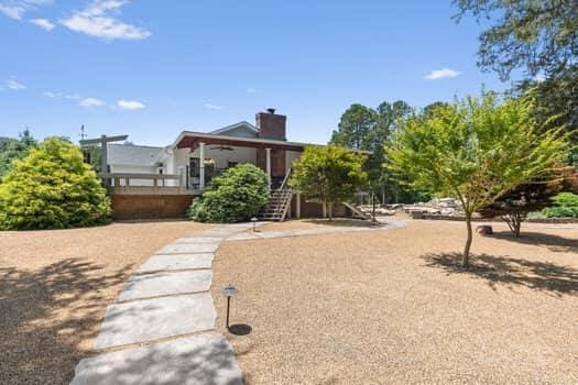 exterior space featuring ceiling fan