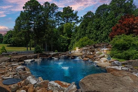 view of pool at dusk