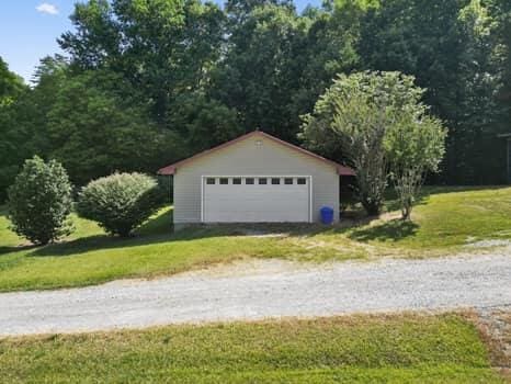 garage with a lawn