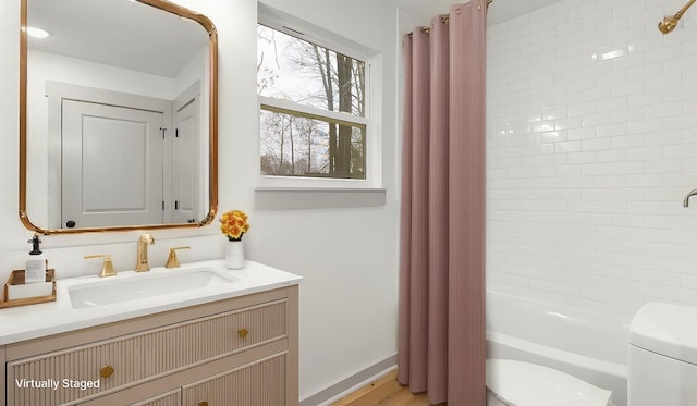 full bathroom with vanity, toilet, and shower / bath combo