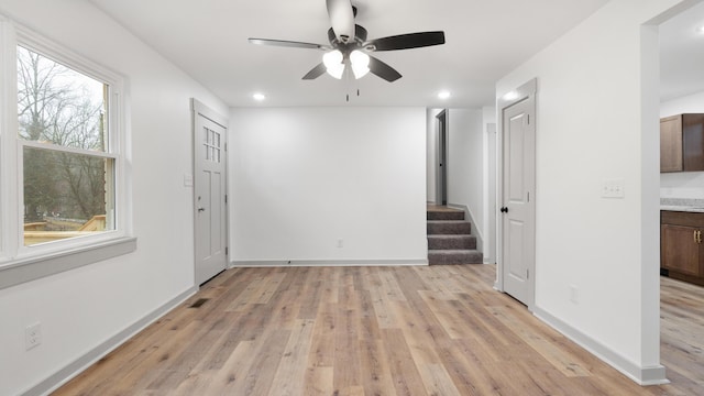 interior space featuring light hardwood / wood-style flooring and ceiling fan