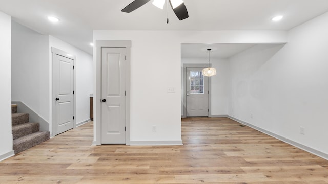 interior space with ceiling fan and light wood-type flooring