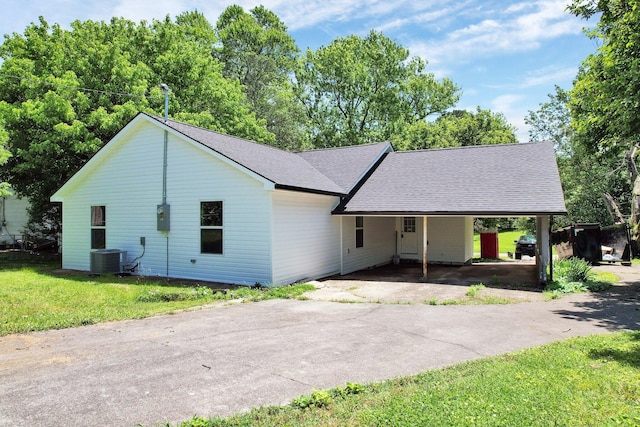 810 Cedar Springs Rd, Athens, TN 37303 - view of front of property with asphalt driveway, a front lawn, a shingled roof, central AC, and a carport