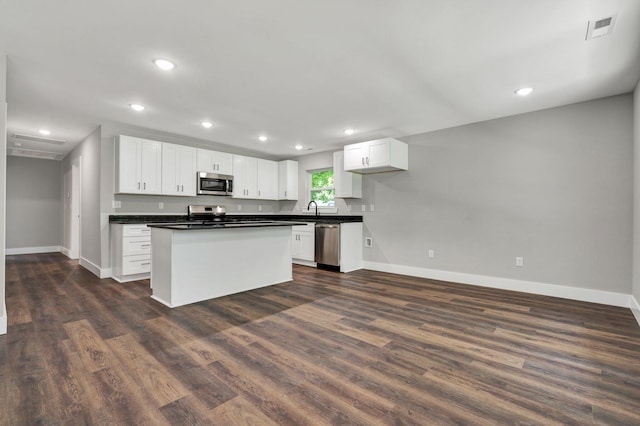 810 Cedar Springs Rd, Athens, TN 37303 - kitchen with stainless steel appliances, baseboards, a sink, dark countertops, and recessed lighting