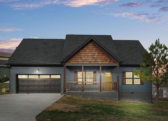 view of front of house with a garage and a porch