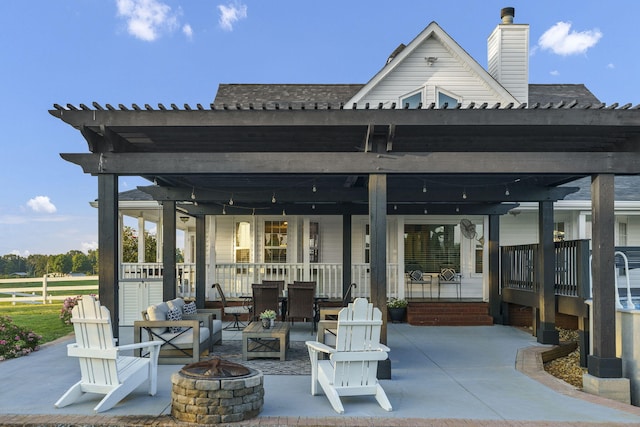 view of patio / terrace featuring an outdoor living space with a fire pit