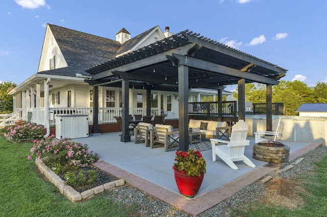 view of patio / terrace featuring a pergola and an outdoor living space with a fire pit