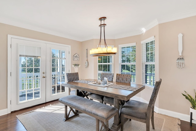 dining room featuring french doors, crown molding, and wood-type flooring