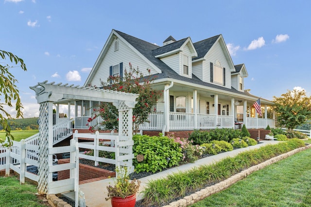 view of front of home featuring a porch and a pergola