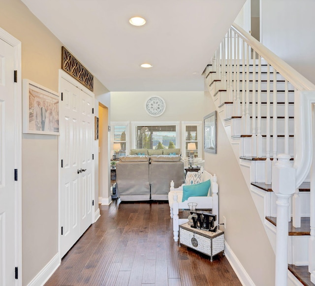 foyer entrance with dark hardwood / wood-style flooring