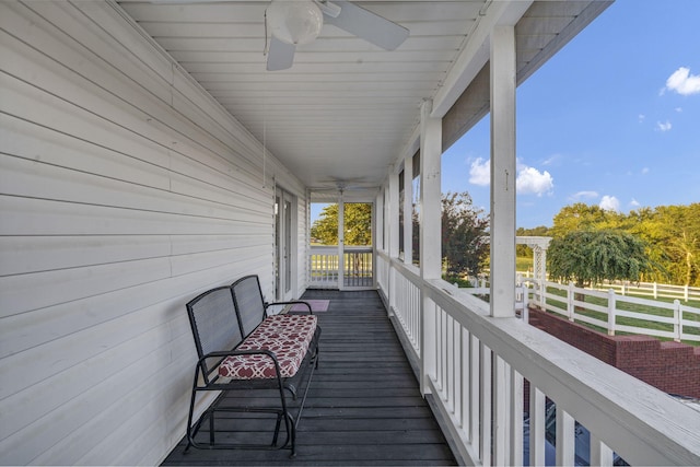 deck with covered porch and ceiling fan